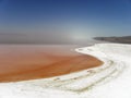 Strange view of Urmia Salt Lake. The salty beach and its red water