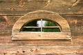 Strange window in wooden wall Royalty Free Stock Photo