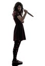 Strange young woman killer holding bloody knife silhouette Royalty Free Stock Photo