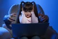 Stranger reaching frightened little child with laptop. Cyber danger