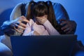 Stranger reaching frightened little child with laptop on color background