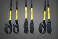 Straps training loop equipment. Black loop functional training equipment on grey background. Sport accessories. Fitness and Gym