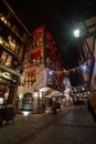 Strasbourg downtown at night during Christmas market, France, vertical