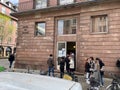 People in the queue waiting at polling station Bureau de Vote. Voters are called