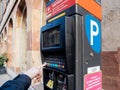 Woman paying for parking at the new Parking ticket payment machine Royalty Free Stock Photo