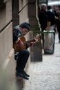 Portrait of musician playing guitar in the street