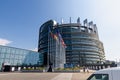 Strasbourg, France. August 2019.The entrance to the modern seat of the European parliament. A row of flagpoles with the flags of