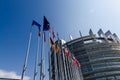 Strasbourg, France. August 2019.The entrance to the modern seat of the European parliament. A row of flagpoles with the flags of