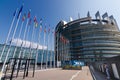 Strasbourg, France. August 2019.The entrance to the modern seat of the European parliament. A row of flagpoles with the flags of