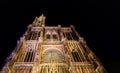 Strasbourg, France, August 2019. Night view of the facade of the magnificent gothic style cathedral, the black background enhances