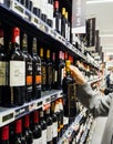 Woman buying shopping for wine in supermarket France Royalty Free Stock Photo