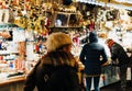 Customers admiring Christmas decorations France Christmas marke