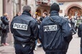 Policemen patroling in the street whit shotguns