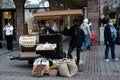 Woman at the hot chestnuts vintage stand in the street Royalty Free Stock Photo