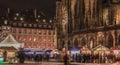 Street atmosphere at night on Notre Dame Cathedral Square where Christmas markets were installed - Strasbourg Royalty Free Stock Photo