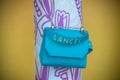 Closeup of blue leather handbag by Lancel Paris in a luxury fashion store showroom