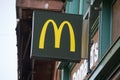 Mc Donald`s logo on fast food entry in the street