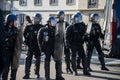 french riot gendarmes standing with helmets in the street
