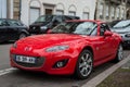 Front view of vintage red Mazda MX5 parked in the street