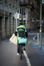 Uber eats delivery man with backpack on a bicycle in the street