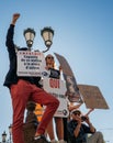 Low angle view of young French people with multiple placards at a protest