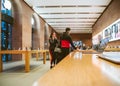 Couple inside Apple Store deciding to buy latest MacBook Pro