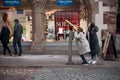 Chinese tourists watching in a binoculars in the street