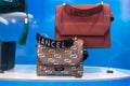 Brown leather handbag by Lancel in a uxury fashion store showroom