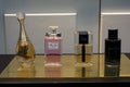 Luxury bottles of french perfume by Dior in a perfumery store