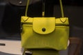 CLoseup of yellow leather handbag by Longchamp in a luxury fashion store showroom Royalty Free Stock Photo