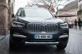 Front view of grey BMW X3 parked in the street Royalty Free Stock Photo