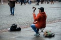 Portrait of musician playing traditional Mongolian violin in the street