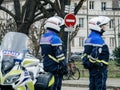 Silhouette of French police officers next to their morotcycle wi