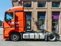 REd Mercedes Benz Actros truck parked in City