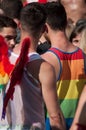 Portrait on men wearing rainbow wings of angel and rainwox teeshirts during the Gay pride parade 2019