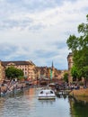 STRASBOURG, FRANCE - June 2019: View on Strasbourg city life boat trip, citizens and tourists having picnic on the river side