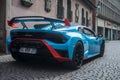 Rear view of orange and blue Lamborghini huracan STO parked in the street Royalty Free Stock Photo