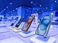 Row of iPhone 15 Pro Smartphones with FNAC Store Background