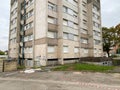 Tall abandoned apartment building Habitation a Loyer Modere, generally called