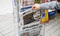 Woman buying German Die Zeit newspaper with Angela Merkel Royalty Free Stock Photo