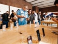 Couple in Apple Store with iPhone Xs and Xs Max