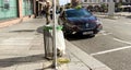 Taxi driver smoking near his luxury Renault car in central Strasbourg place