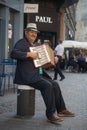 portrait of accordionist playing in the street