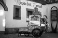 Portrait of man playing with a barrel organ in the street