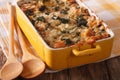 Strata casserole with spinach, cheese and bread close up. Horizontal