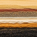 Strata of varied colors and textures including black brown white Royalty Free Stock Photo