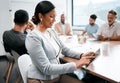 Strategic meeting in progress. an attractive young businesswoman attending a meeting in the boardroom with her Royalty Free Stock Photo