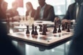 Strategic Moves: Chess Game Amidst Business Meeting and Blurred Colleagues