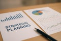 Strategic Planning Documents With Graphs and Charts on a Wooden Table Royalty Free Stock Photo