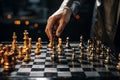 Strategists hand plays chess, using metaphor to plan business moves with precision